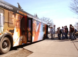 college-students-board-bus Buses Popular at Universities